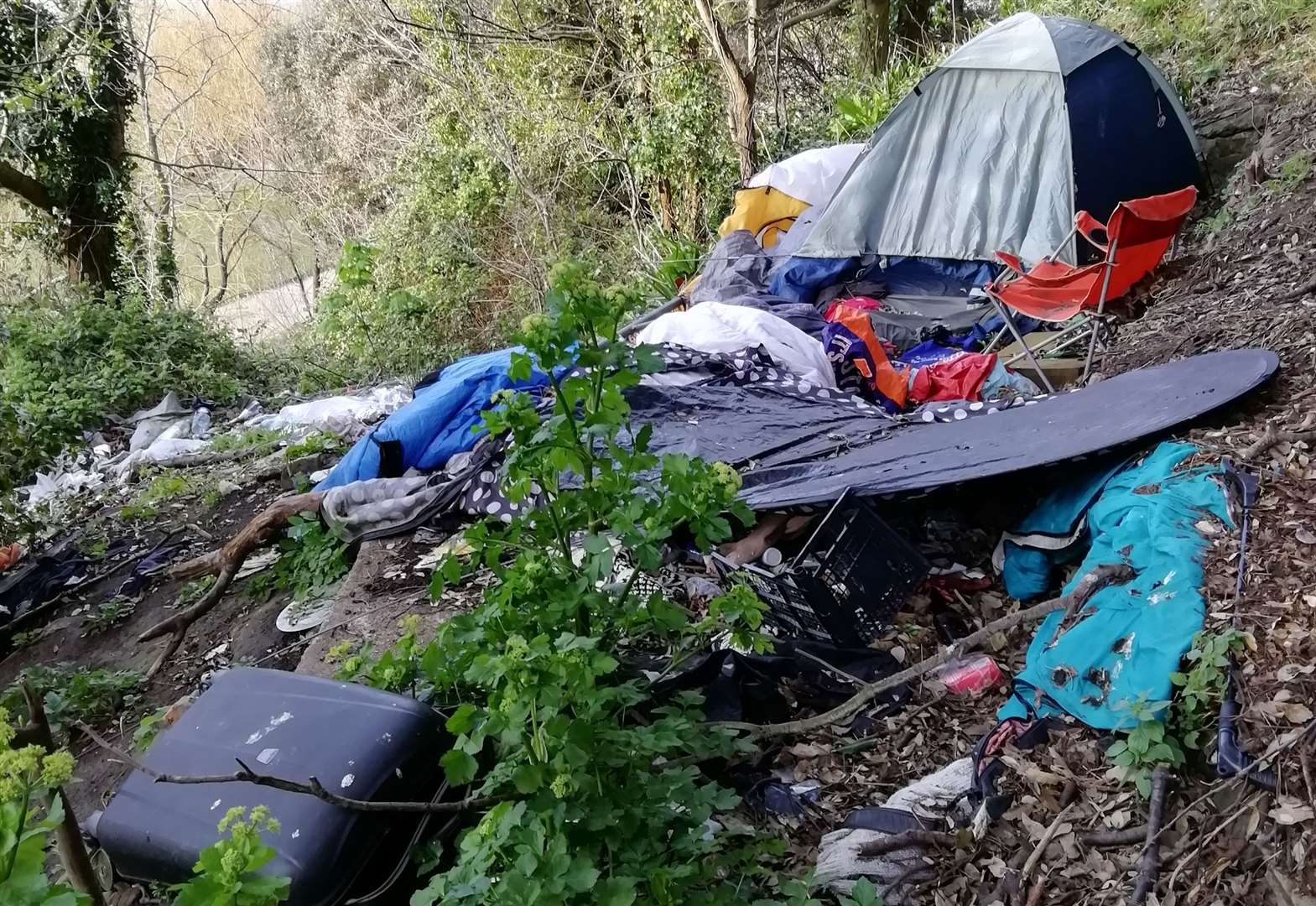 Clothing, discarded food and drink packaging and camping equipment have been dumped at two sites