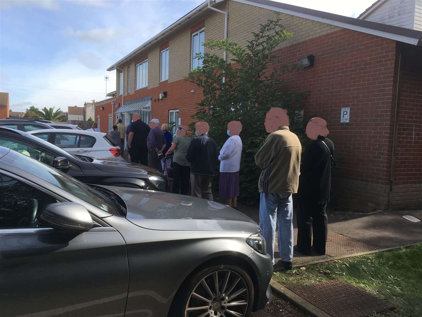 Patients wait for their free flu jabs in the car park at St George's Medical Centre, Sheerness