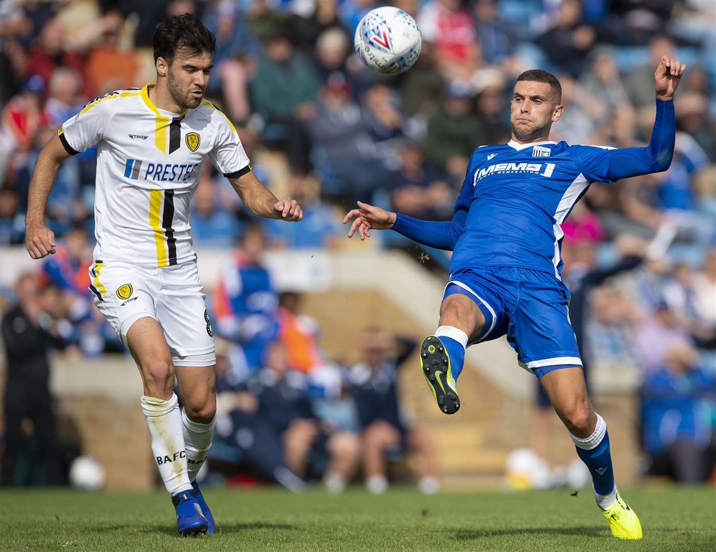 Gillingham's Stuart O'Keefe gets to the ball ahead of Scott Fraser Picture: Ady Kerry