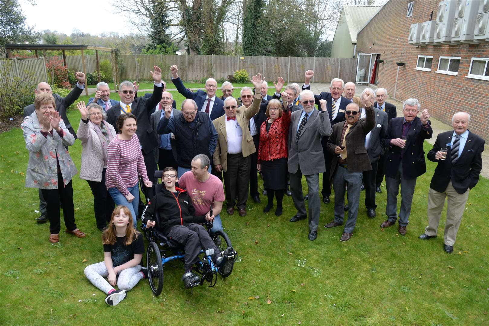 Nathaniel Hurley with grandparents, parents and sister Alex and members of the Rotary Club's of Maidstone and Maidstone Riverside, Maidstone Lions and the Bennett Paine Trust after the presentation his new tricycle at The Cornwallis Suite on Friday. Picture: Chris Davey. (8510507)