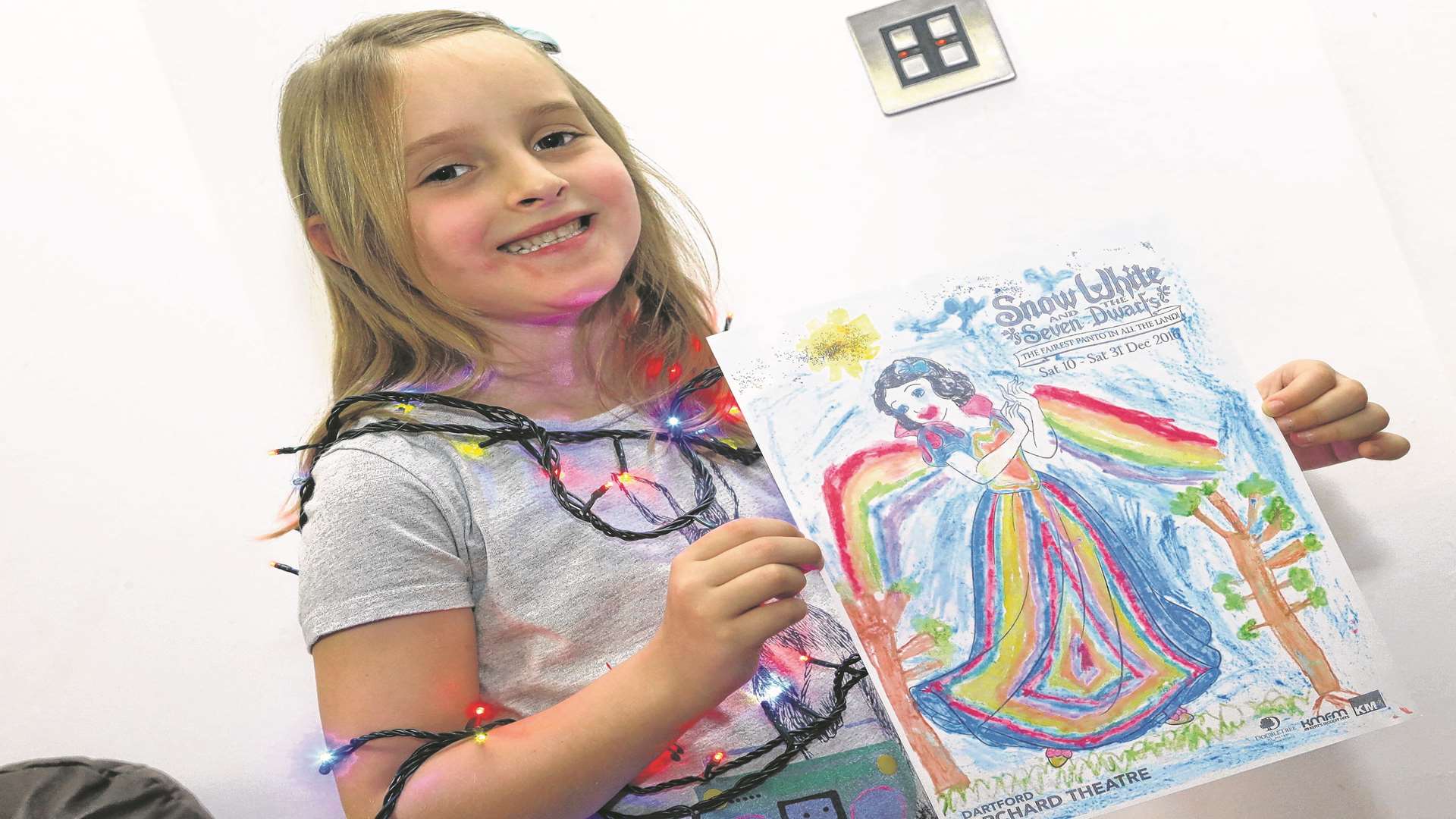 Olivia Moss, shows off her winning picture entry, colouring in competition sponsored by The Orchard Theatre. The six year old won the prize of switching on Dartford's Christmas lights.