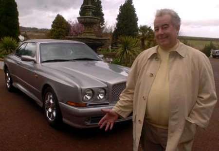 Car dealer Peter Jarvis with the Bentley once owned by Mike Tyson. Picture: STEVE CRISPE