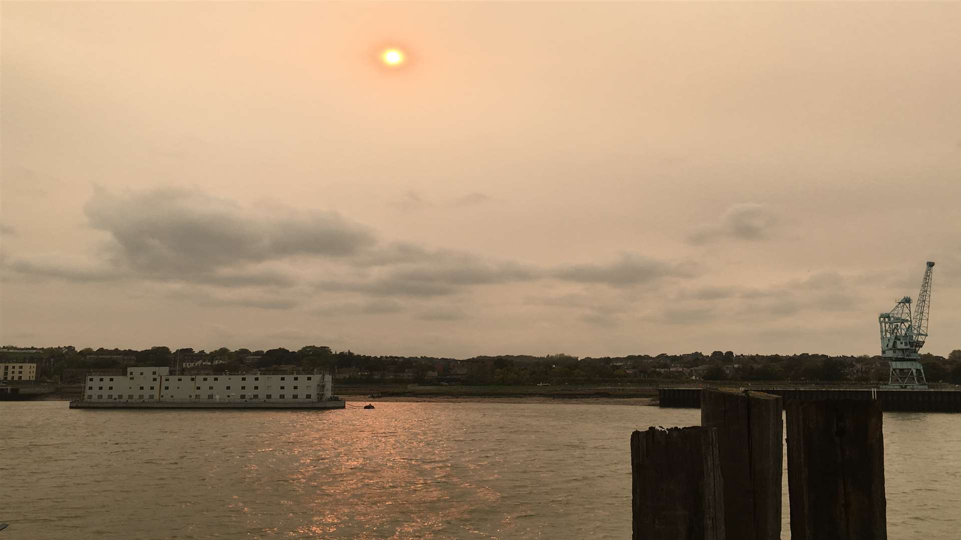 The pink sun casts a rose gold glow over the River Medway in Rochester