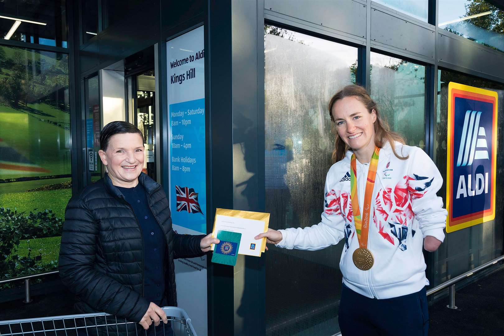 Kings Hill Aldi first customer Debra Arnold with Paralympics GB athlete Claire Cashmore. Picture: McCann