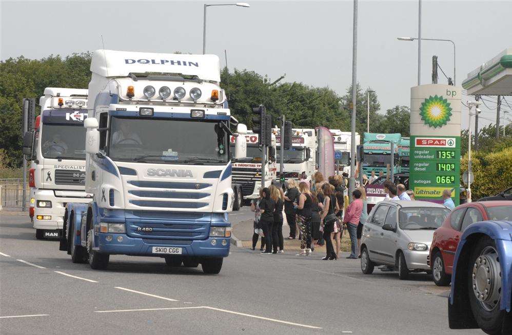 The funeral procession for lorry driver Ryan Bennett passes the BP service station at Queenborough Corner
