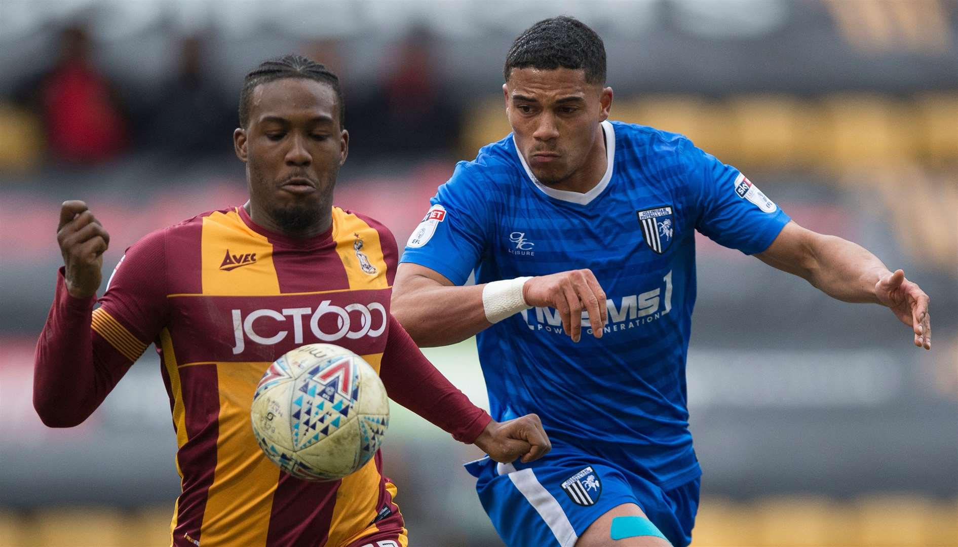 Dominic Poleon, left, looks to hold off Gillingham's Bradley Garmston while playing for Bradford. Picture: Ady Kerry