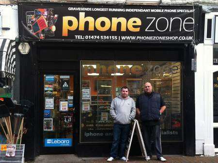 Phone engineer Darren Corcoran and shop owner Daniel Bennet outside Phonezone where the images were discovered