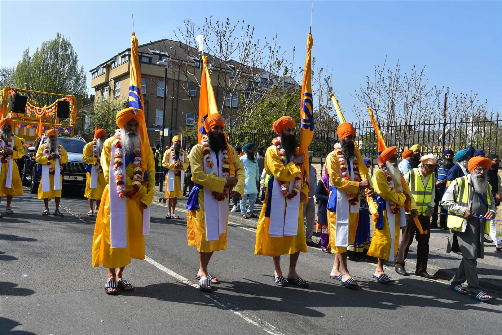 Flag bearers followed by the holy Sikh scriptures on a special model of the Golden Temple. Picture: Jason Arthur