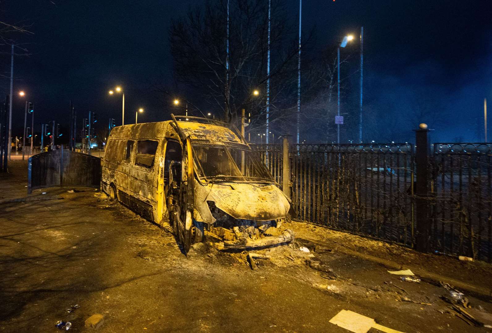 A burnt out police van after a demonstration outside the Suites Hotel in Knowsley, Merseyside in February (Peter Powell/PA)