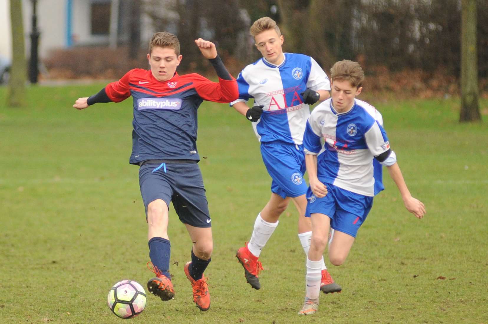 Bredhurst Juniors (blue and white) close in on Hempstead Valley Colts in the Under-16 League Cup, second round Picture: Steve Crispe