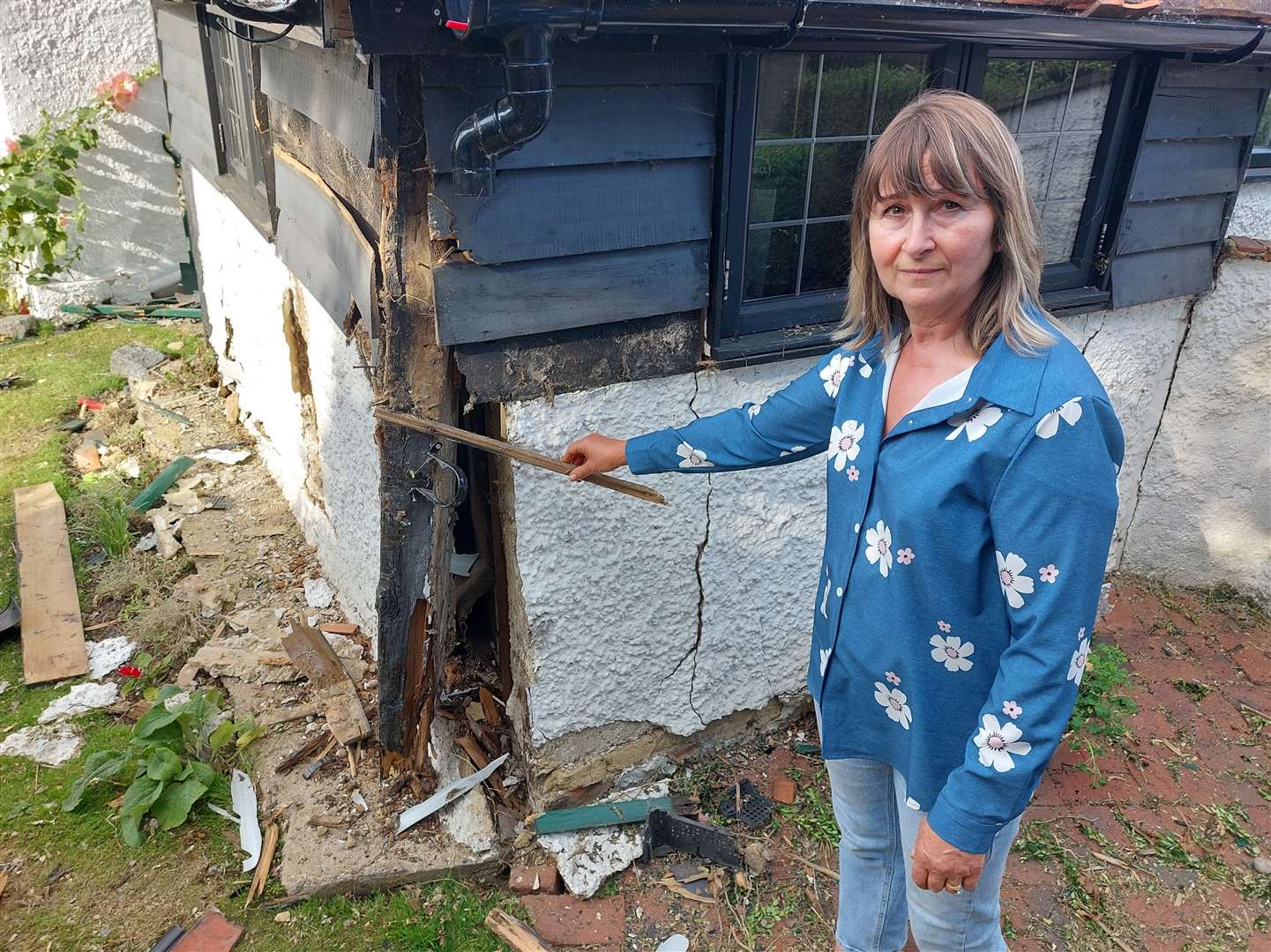 Herne villager Monika Burns inspecting the damage to her home