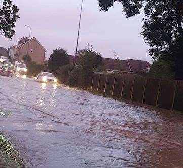 Grovehurst Road is flooded in Kemsley. Picture: Alex Matthews