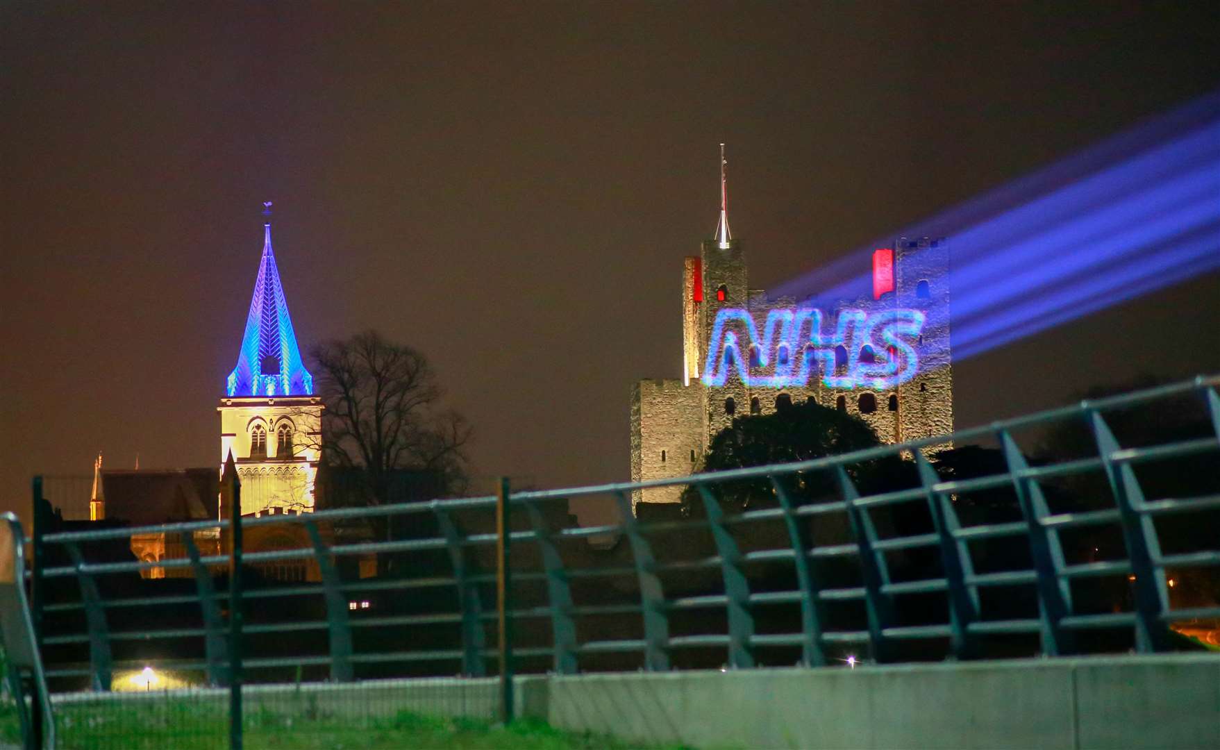 The NHS logo beamed onto the side of Rochester Castle as the Cathedral next door is lit up blue for the Clap for Carers. Picture: Kent Media Group