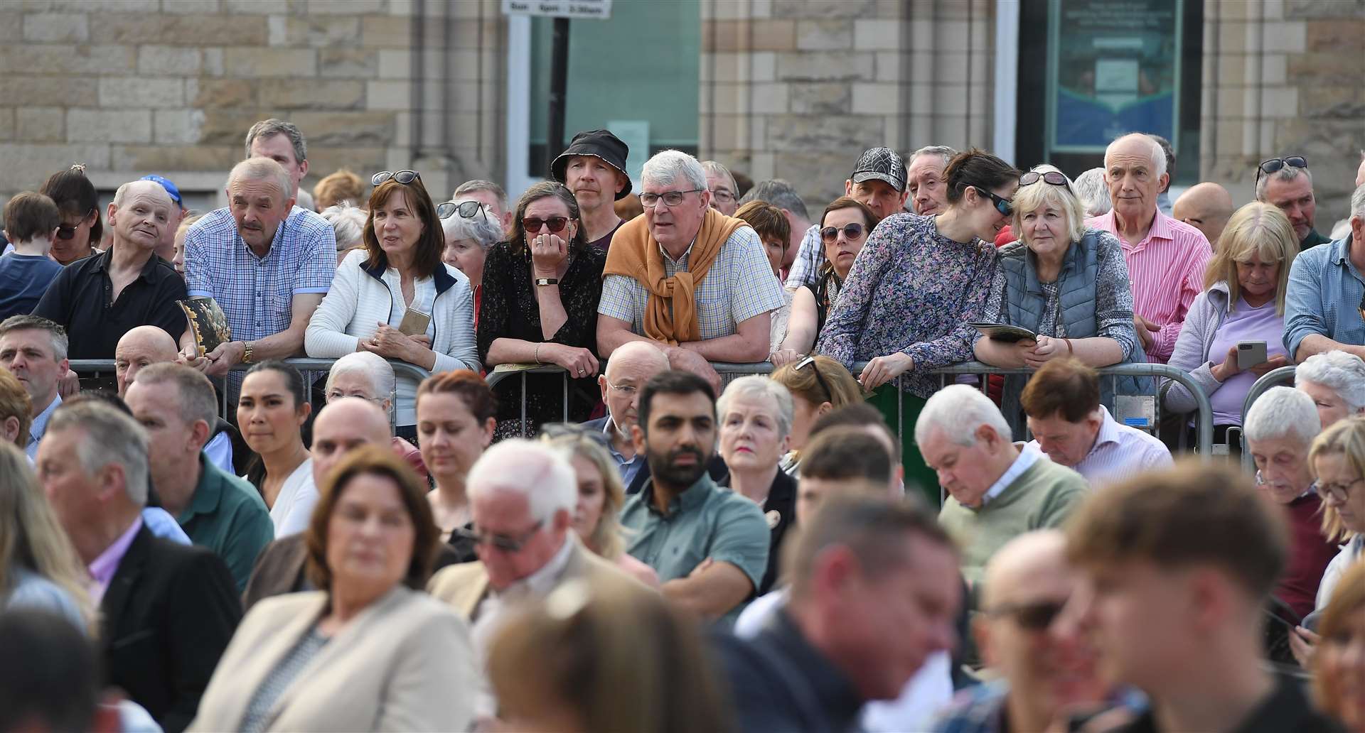 People during a wreath-laying ceremony at the Memorial to the victims of the Dublin and Monaghan bombings (Oliver McVeigh/PA)