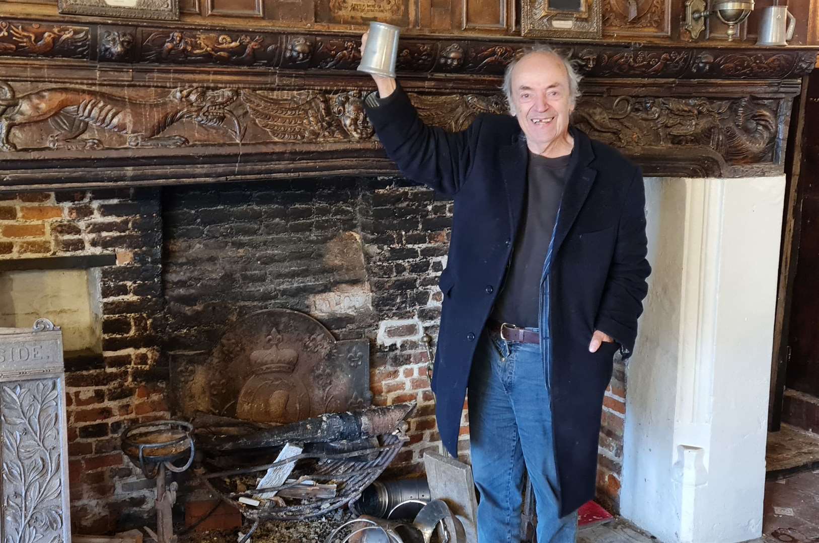 Peter Malkin has removed the wood burner to bring back the original inglenook fireplace