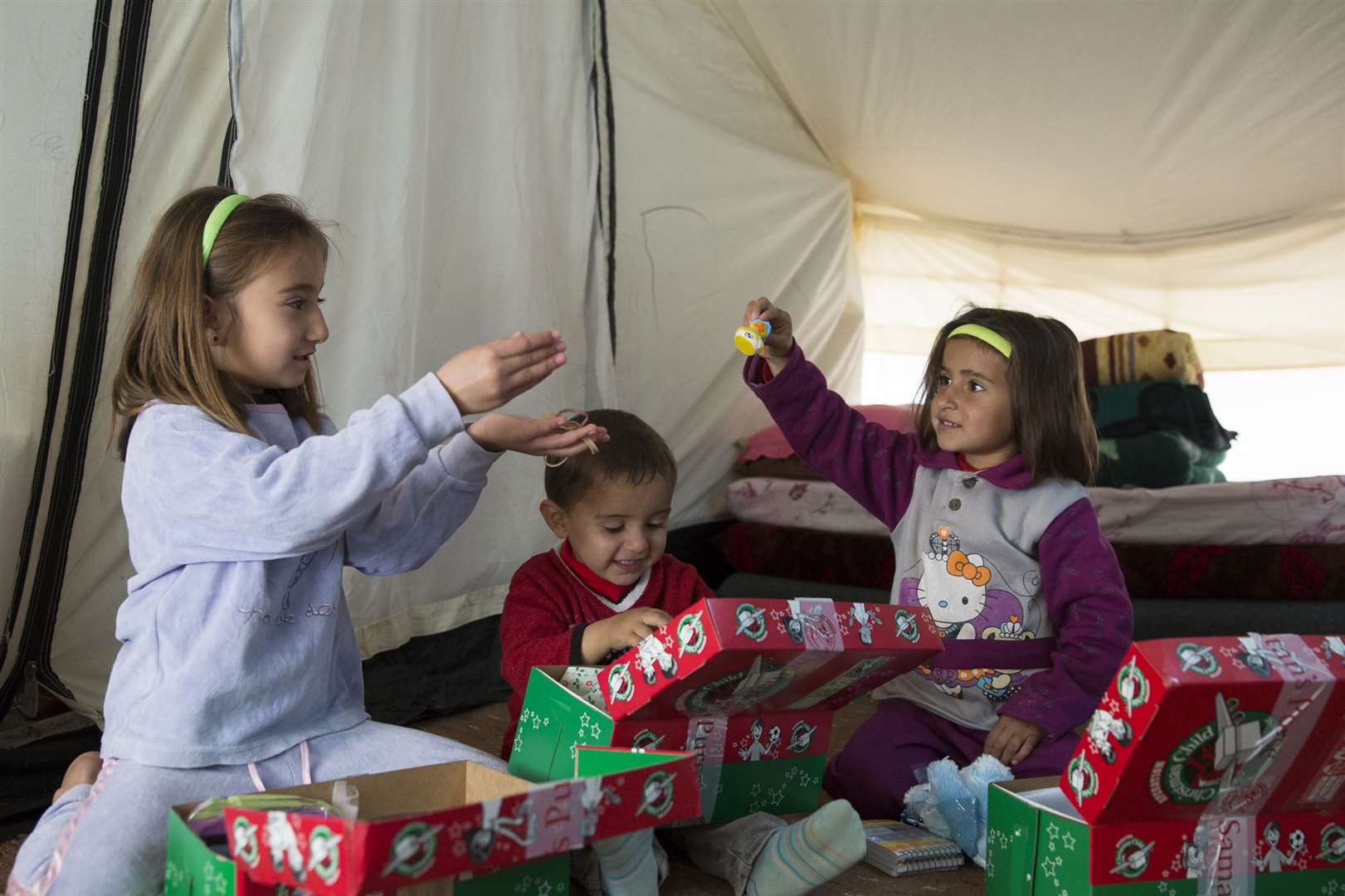 Child refugees with shoeboxes from Operation Christmas Child. Picture: Samaritan's Purse