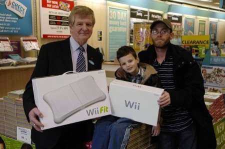 Ashley, with store manager David Bray and dad Alan Richens. Picture: Matthew Walker