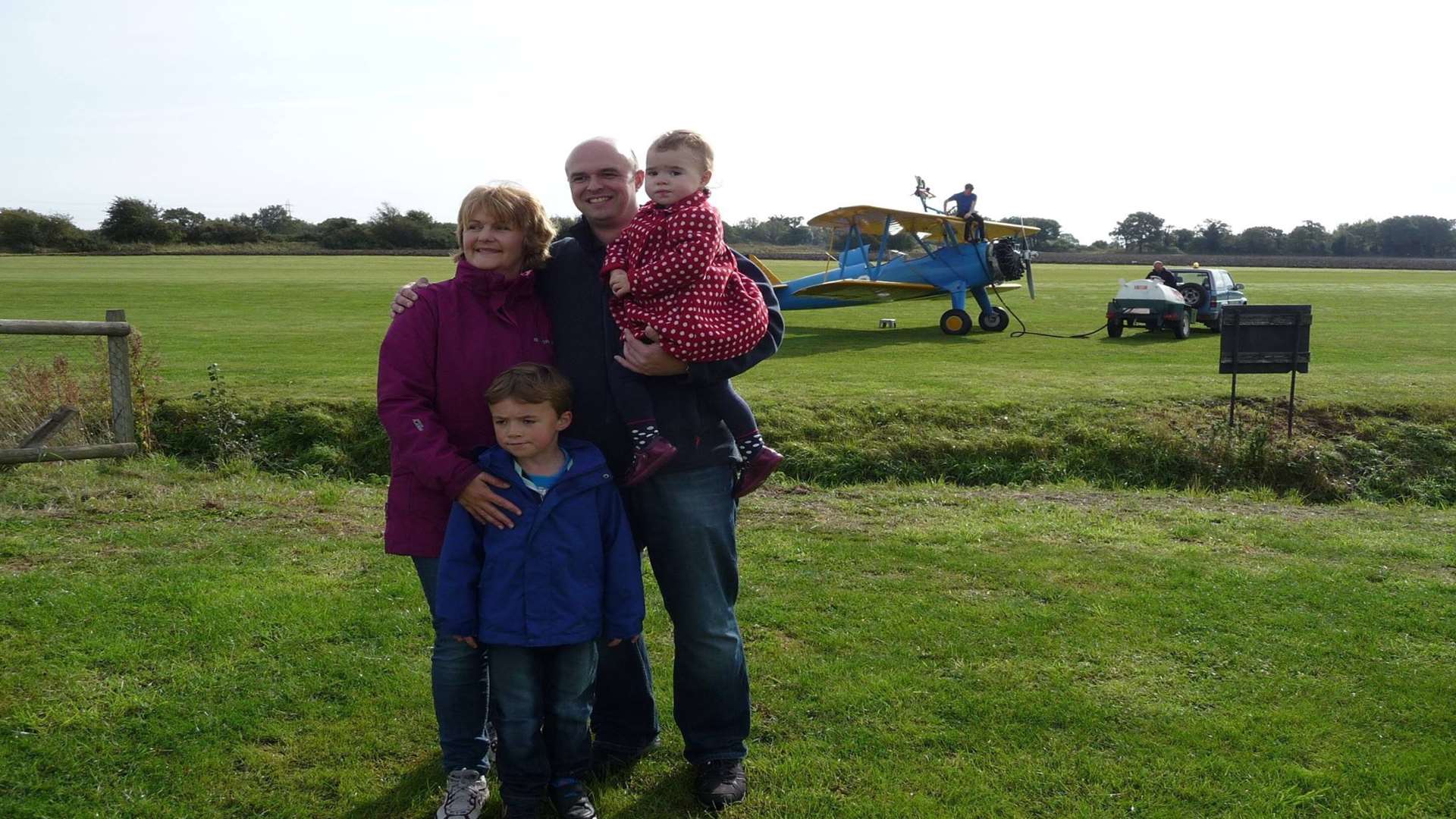 Joanne Aston, pictured with her family, took on various challenges after her diagnosis, including a sponsored wingwalk.