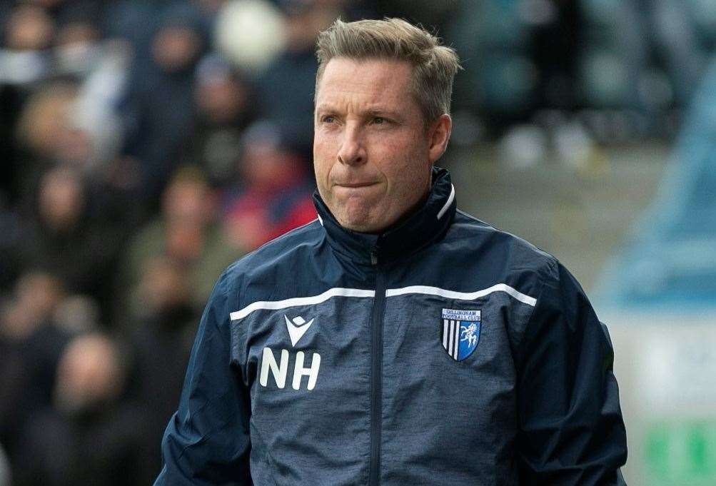 Gillingham manager Neil Harris is looking at adding another five players to his “core group”