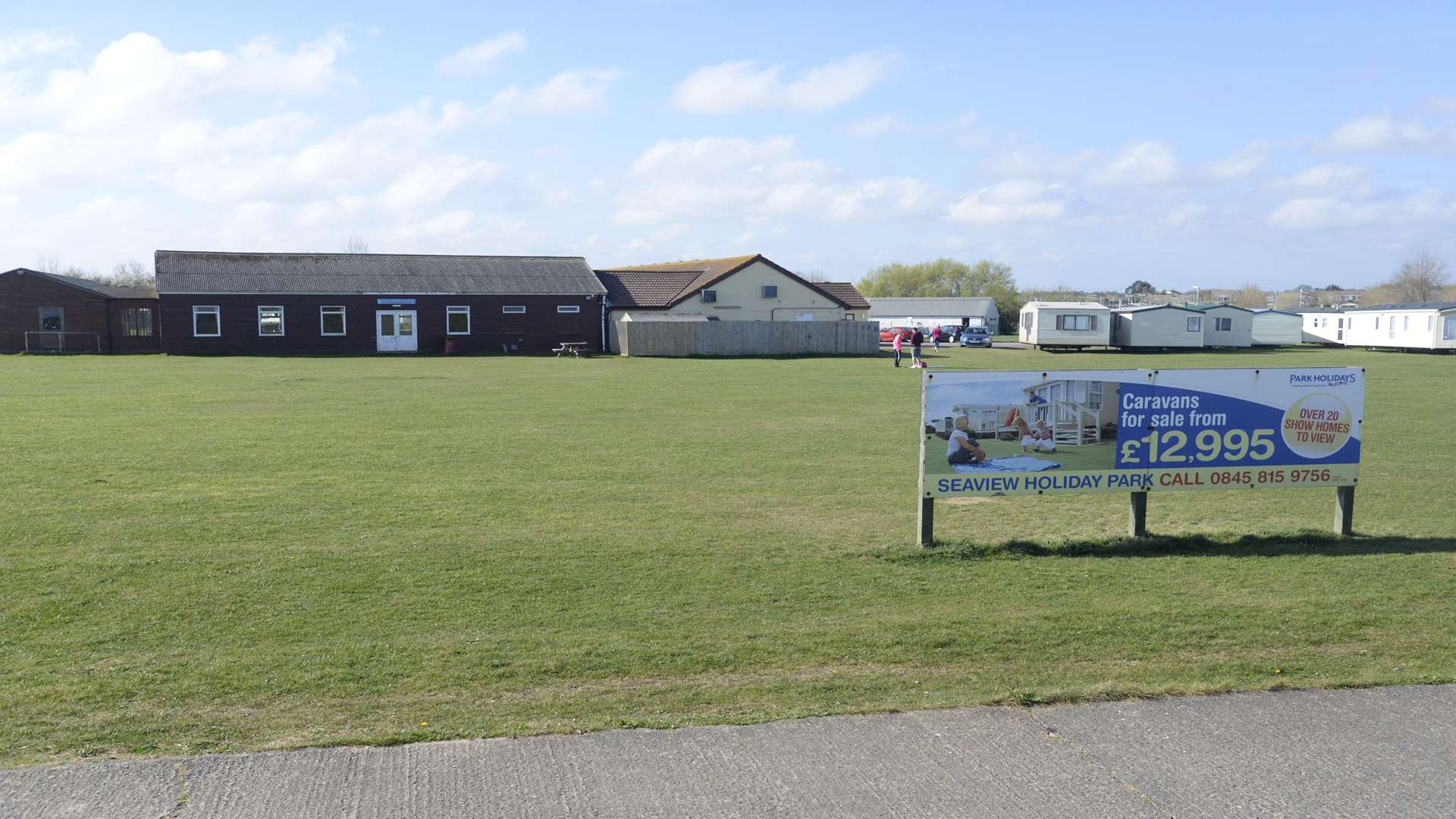 The field between the Seaview Holiday Park clubhouse and the sea wall