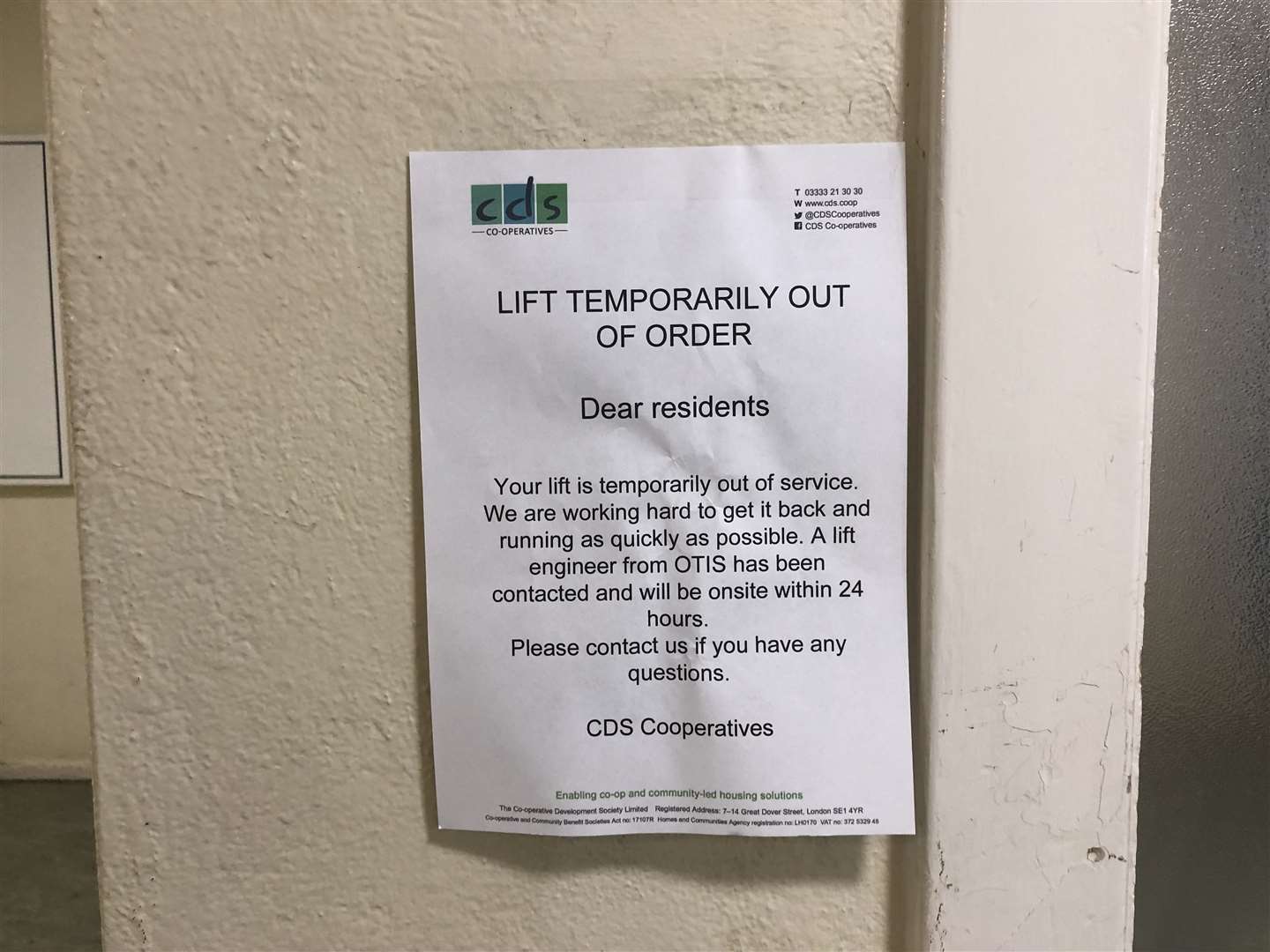 An out of order sign next to the lift