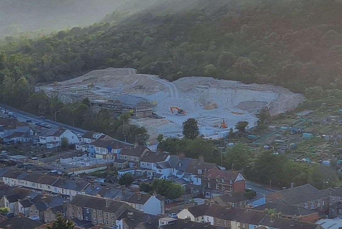 The new development is seen in the background, surrounded by the existing houses at Maxton