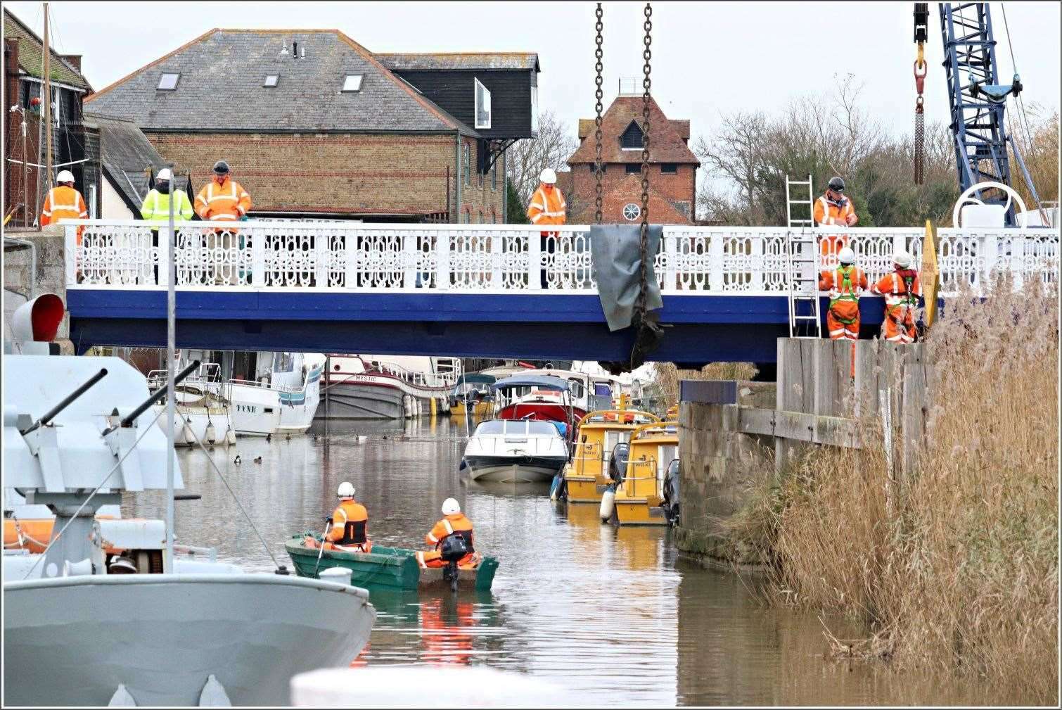Contractors worked throughout Friday to reinstate the bridge over the River Stour. Picture: Lyn Groombridge