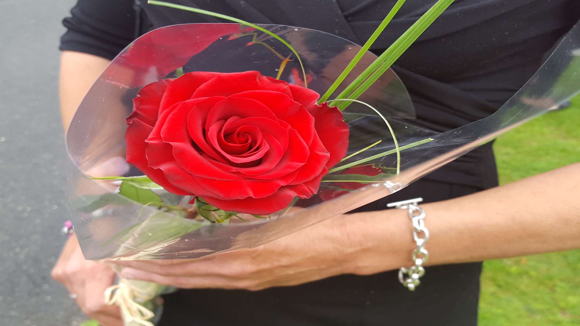 A rose is held as tribute to tragic Taiyah