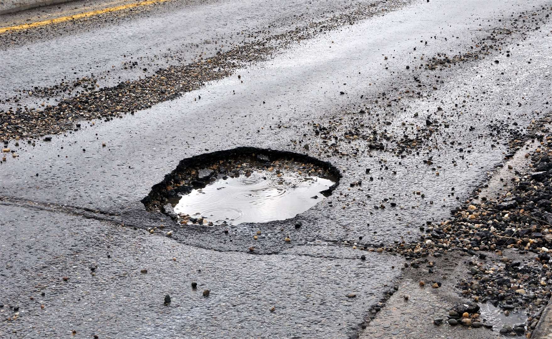 Thirty-two potholes were set to be filled in. Stock image