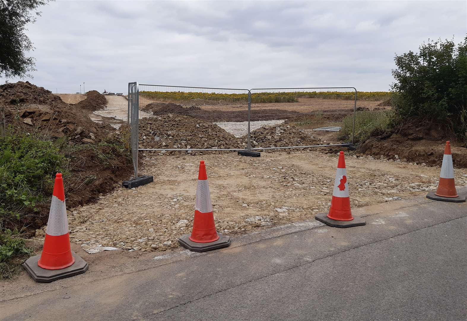 Part of a hedge was removed in July to make a temporary access point to the site