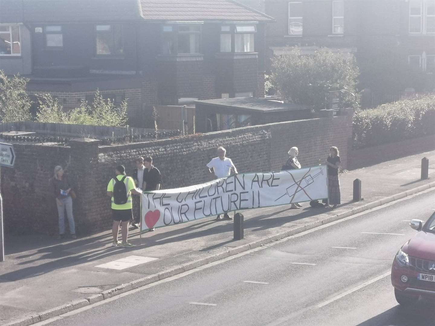 Anti-vaxxers outside The Abbey School in Faversham earlier this month. Picture: Hannah Perkin