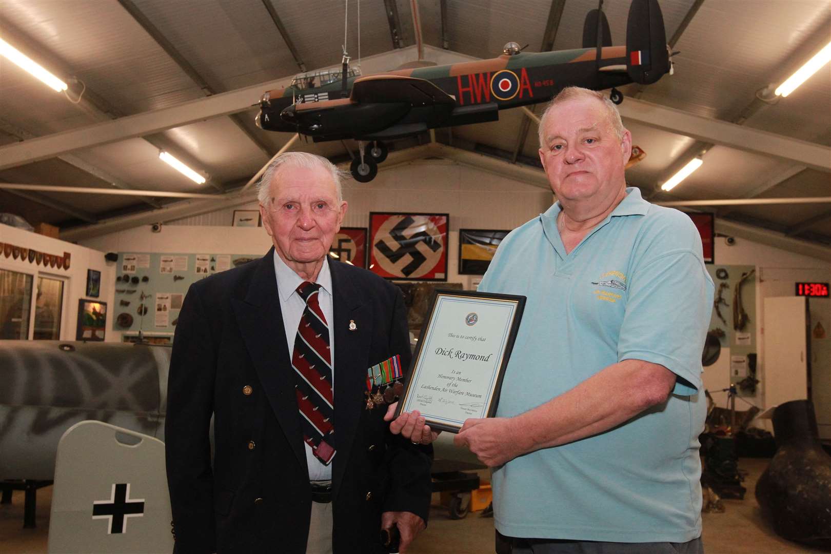 Dick Raymond received an honorary member certificate from Trevor Matthews, trustee at the Lashenden Air Warfare Museum.