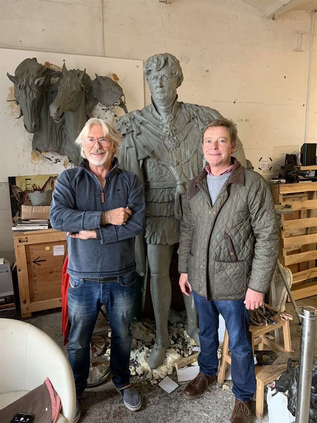 Dominic Grant giving MP Craig Mackinlay a preview of his sculpture of George IV