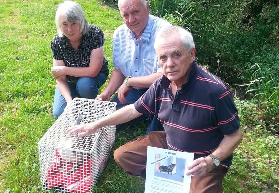 David Gwyn-Jones with his remaining cat Tom and others helping with the search Jenny and Roger Chatfield.