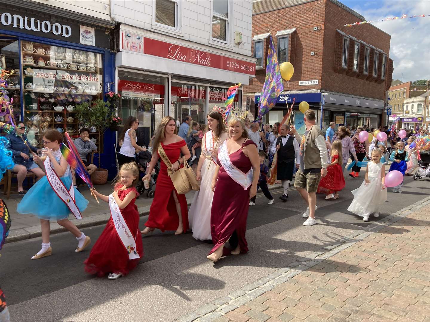 Pageant queens swapped floats for their feet in a walking parade