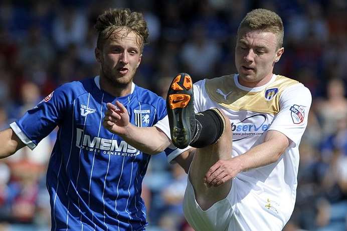 Stephen Butcher (left) in League 1 action for Gillingham against Colchester Picture: Barry Goodwin