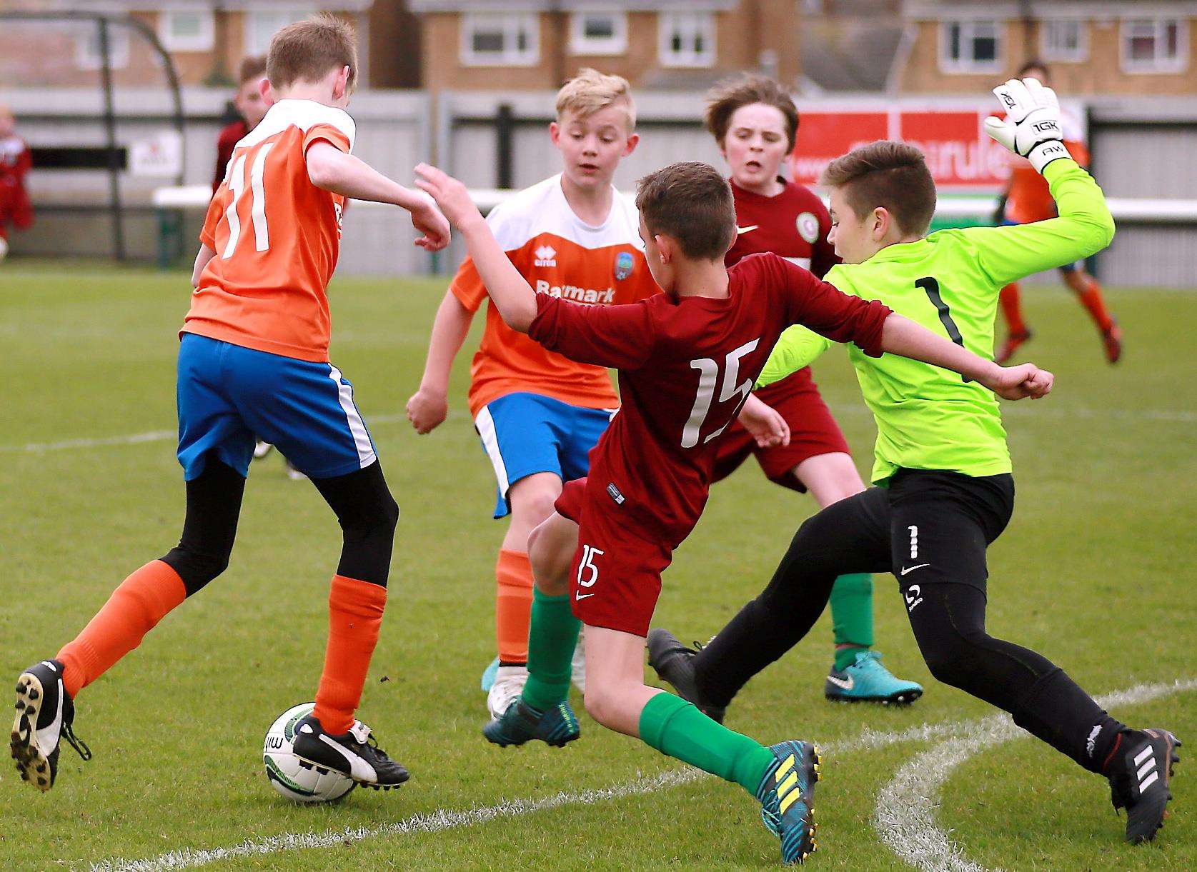 Cuxton 91 under-12s battle against Cobham Colts under-12s in the League Cup final. Picture: Phil Lee FM1660288