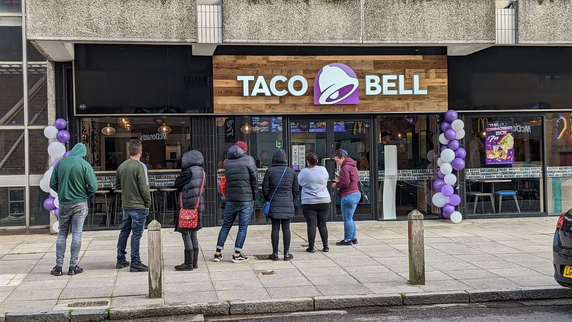 The wind was whipping along West Terrace, in Folkestone, as punters eagerly awaited the opening of the town's new Taco Bell