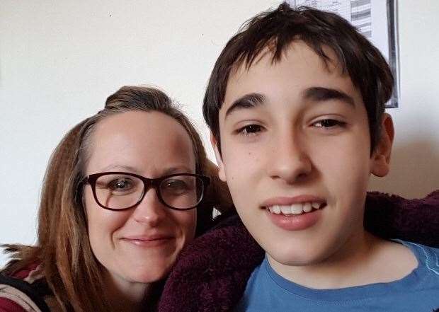 Former GP health assistant Lyn Watson with her autistic son James Tracey (13411721)