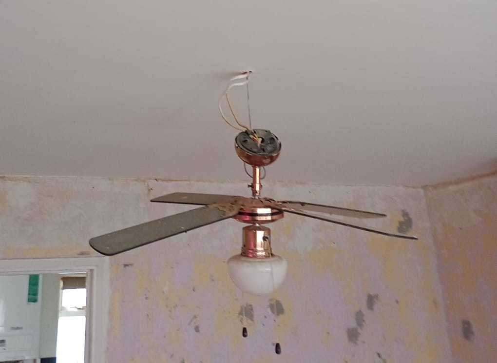 Hole in the ceiling with the hanging fan light. Picture: Stacey Sells