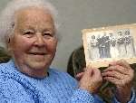 Mary Maskell with a photo of her wedding