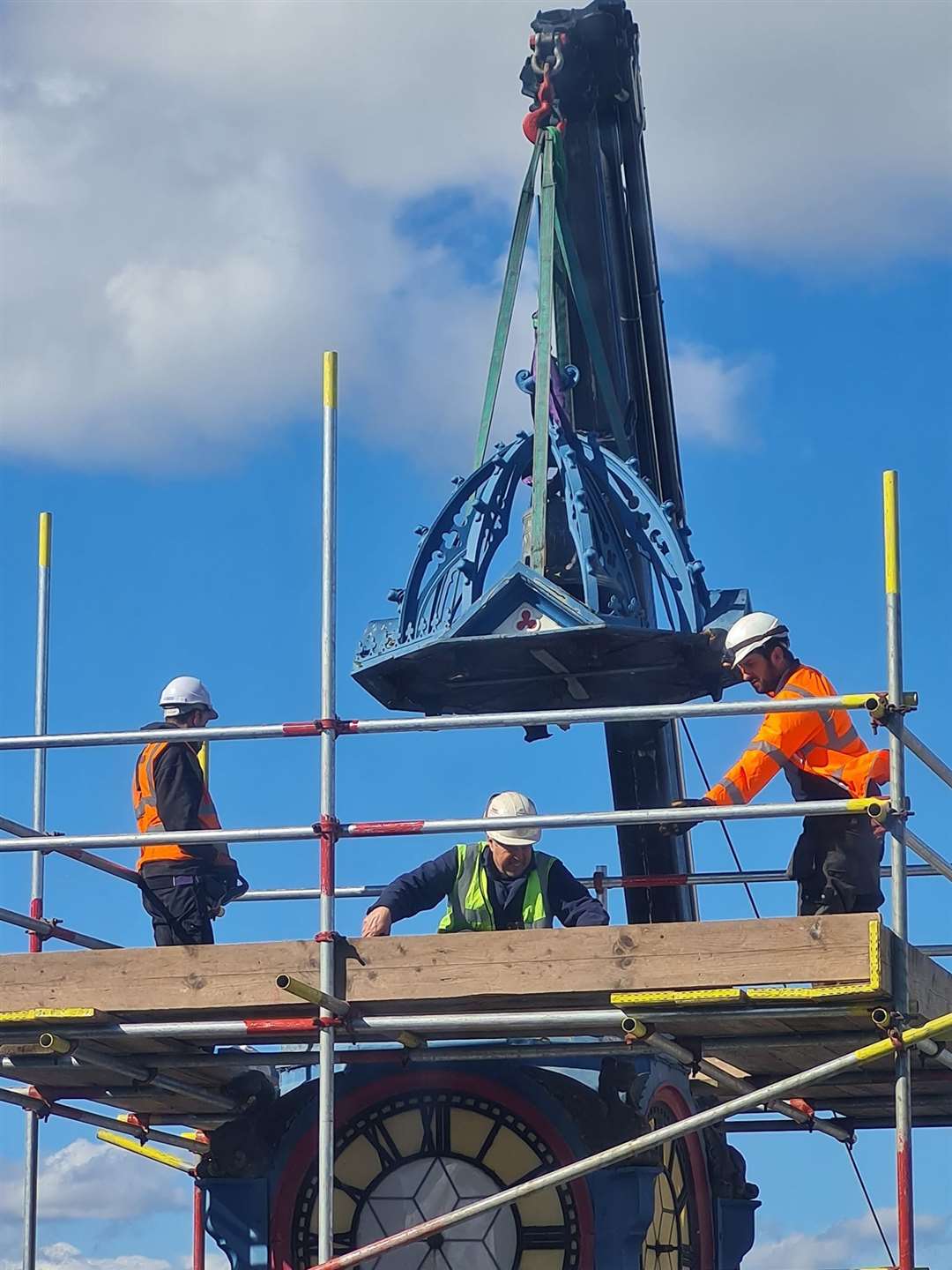 Day One: The roof, bell and 'clock box' of the 119-year-old Sheerness clock tower is removed by Smith of Derby engineers. It will be taken away to be restored. Picture: Donna Mansi