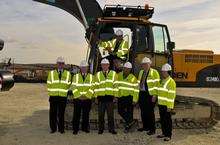 Shahid Malik MP, in the cab of the digger, with MPs, Councillors and SEEDA staff