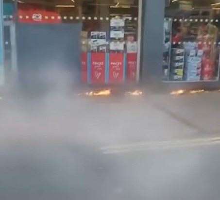 Flames were spotted along the front of Co-op in Cheriton while shoppers were still inside. Picture: Mazdul Islam