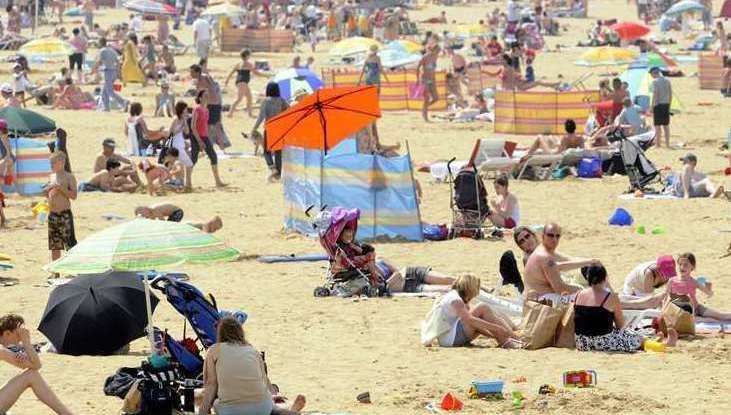 People enjoying the sun on Margate beach