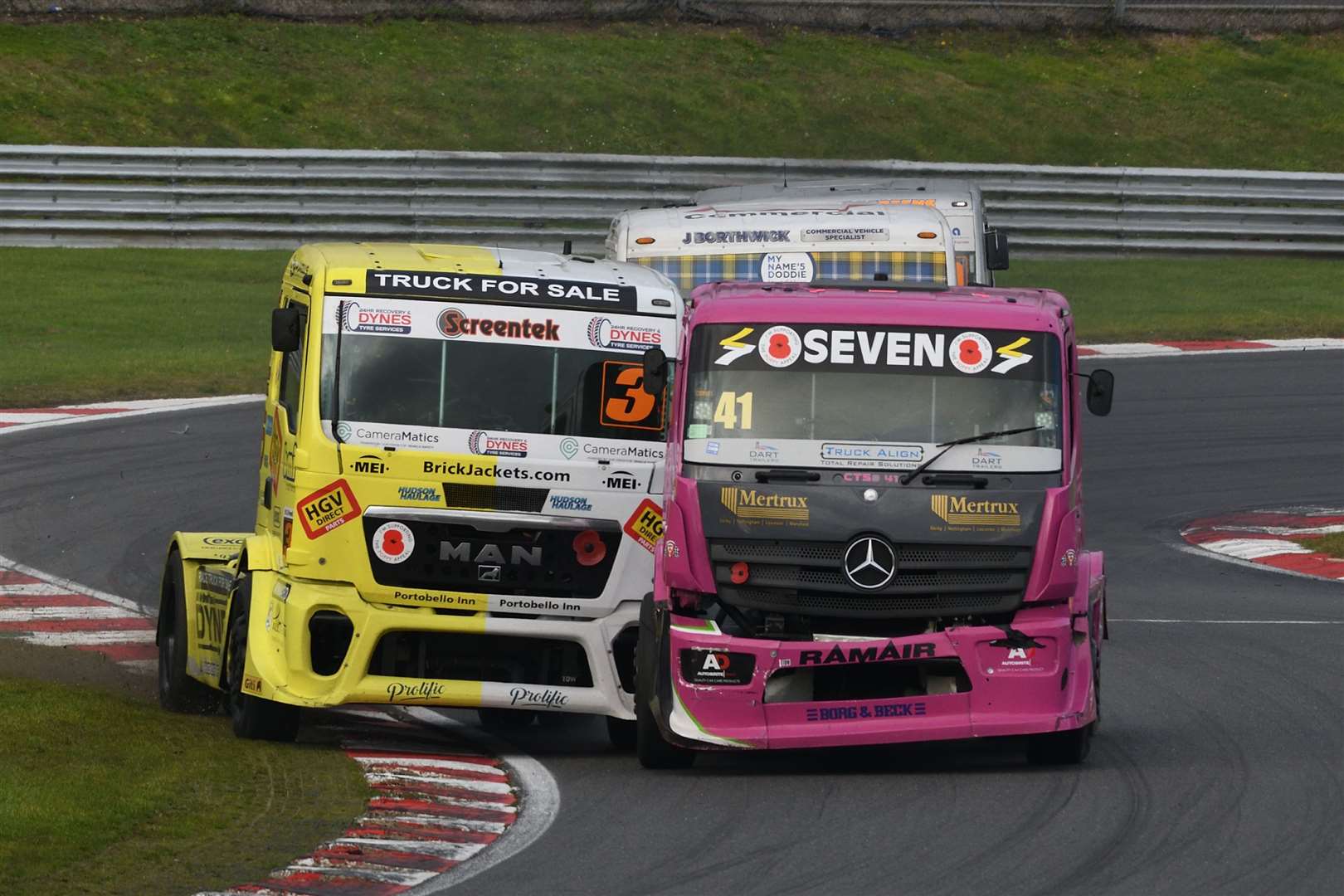 Simon Cole (41), from Dartford, who scored a best of two third places in Division 2 of the British Truck Racing Championship races comes under attack from Steven Powell. Picture: Simon Hildrew (52936760)