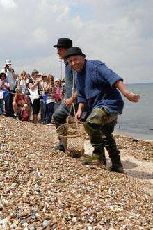 Martin Easton and Lee Sully bring the oysters ashore at Long Beach during this years Whitstable Oyster Festival on Saturday.