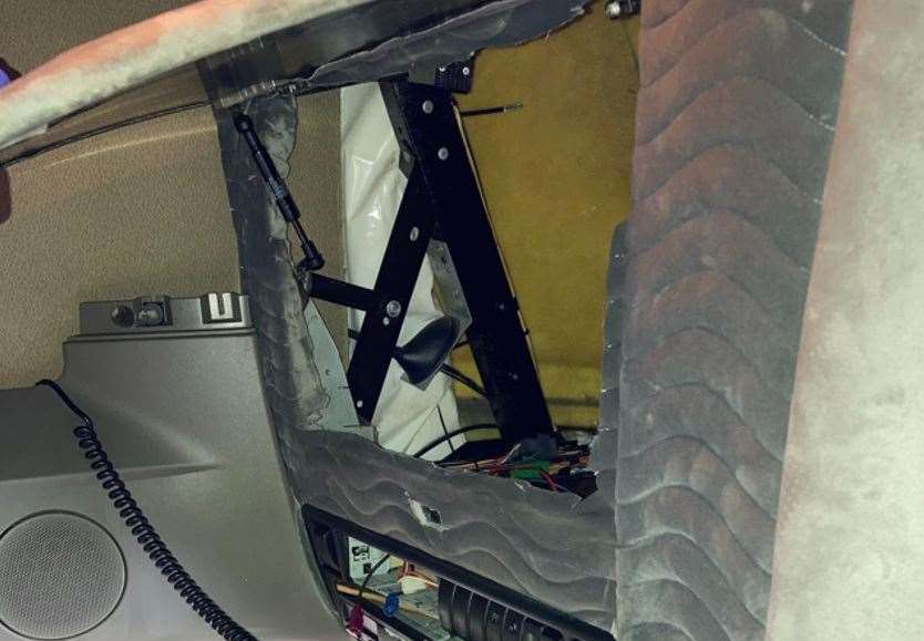 Four people were hidden in the overhead lockers inside the driver’s cab