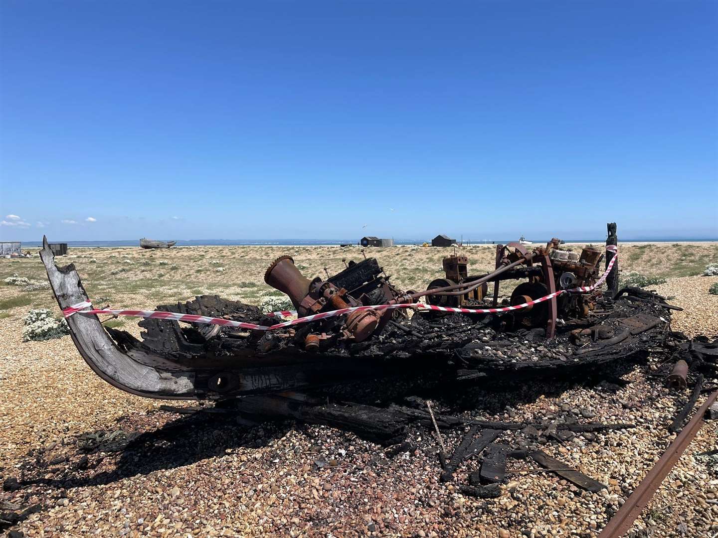 A boat was destroyed by fire on the beach at Dungeness. Photo: Susan Pilcher