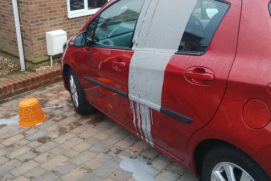 The car was daubed in paint, which came with a threat on a bucket